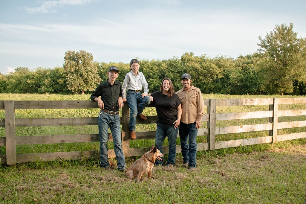 The Stuart family together in the pasture at golden hour